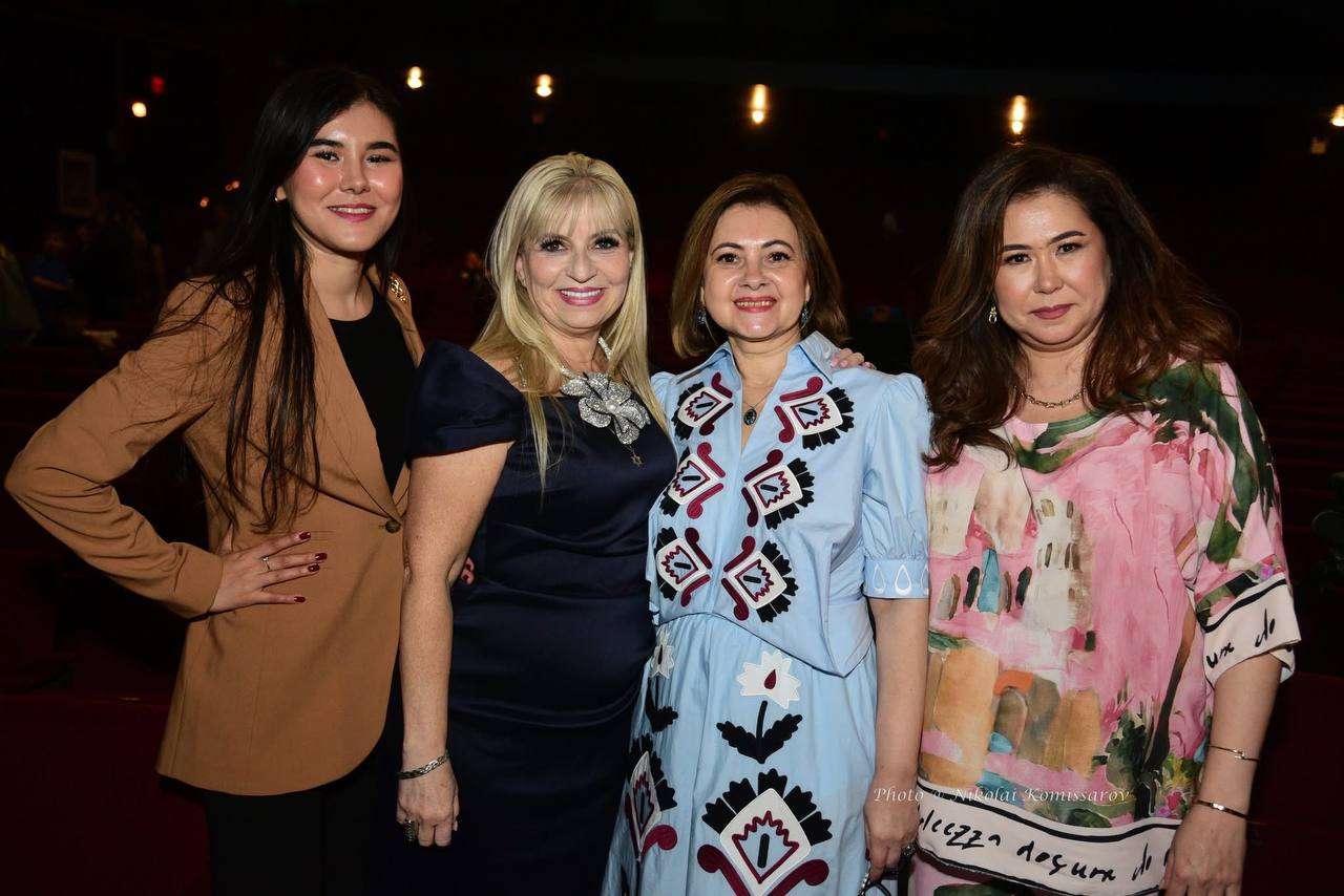 Guests posing together at an evening community event