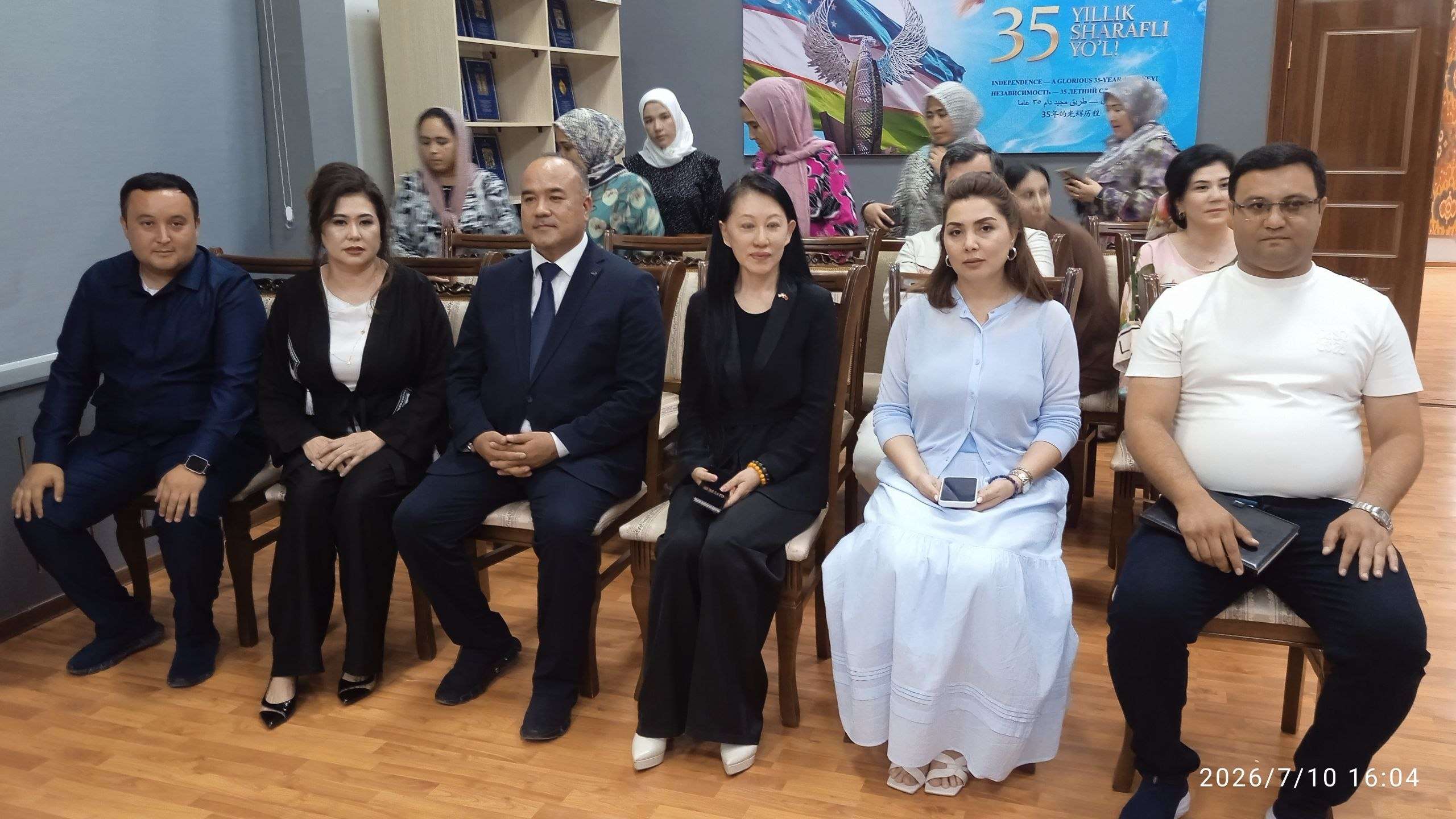 Community members seated for a discussion at a formal gathering