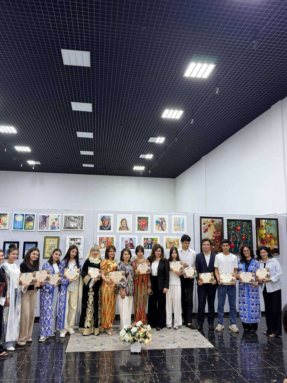 Exhibition participants gathered for a group photograph in the gallery hall
