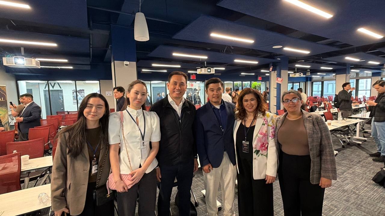 Colleagues gathered for a group photo at a workplace visit