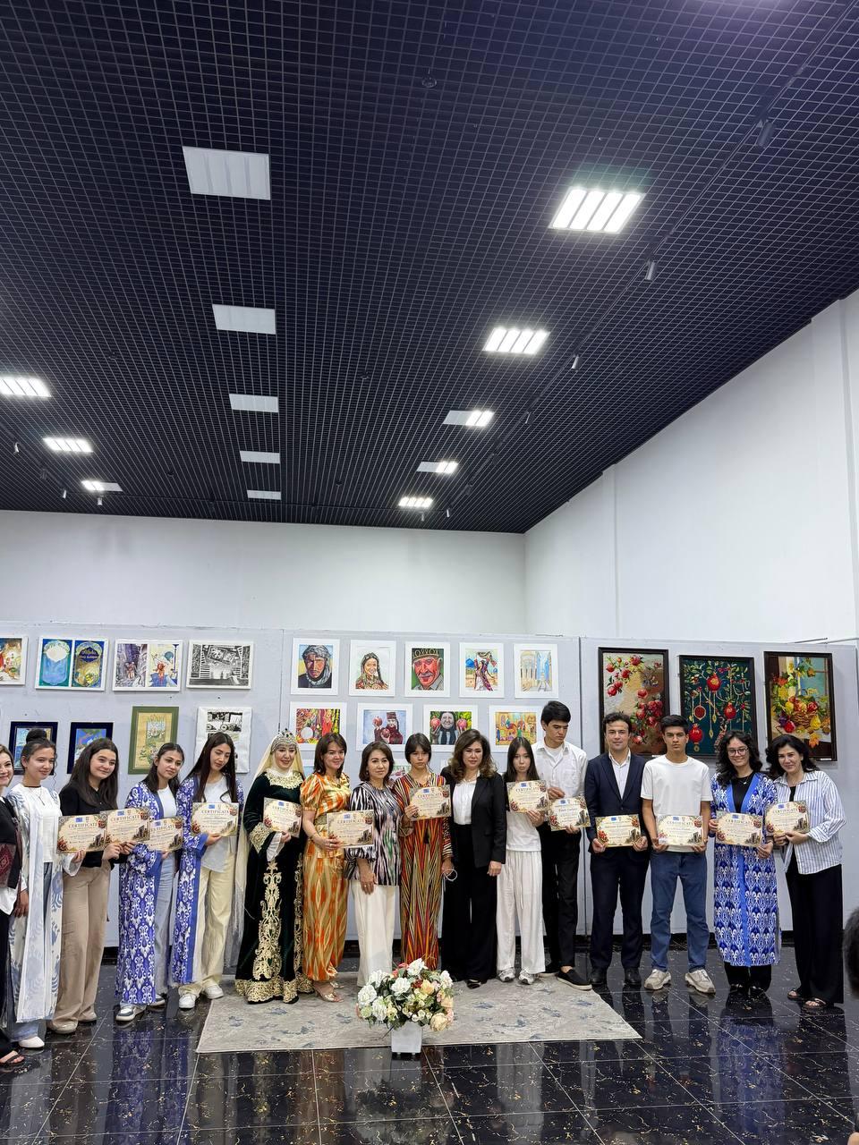 Exhibition participants gathered for a group photograph in the gallery hall